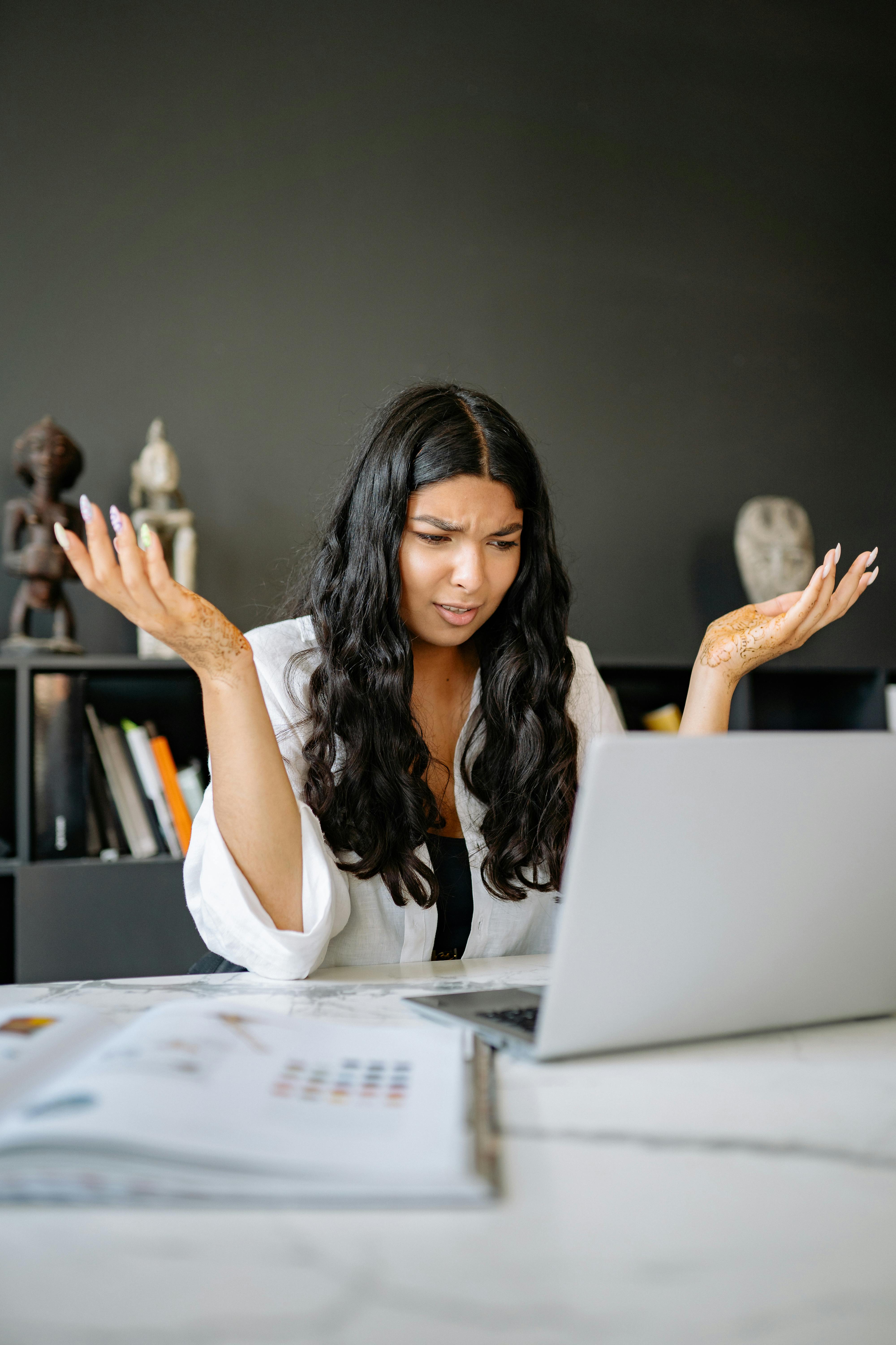 Confused person at a laptop, representing visitors struggling to understand what to do next on a website