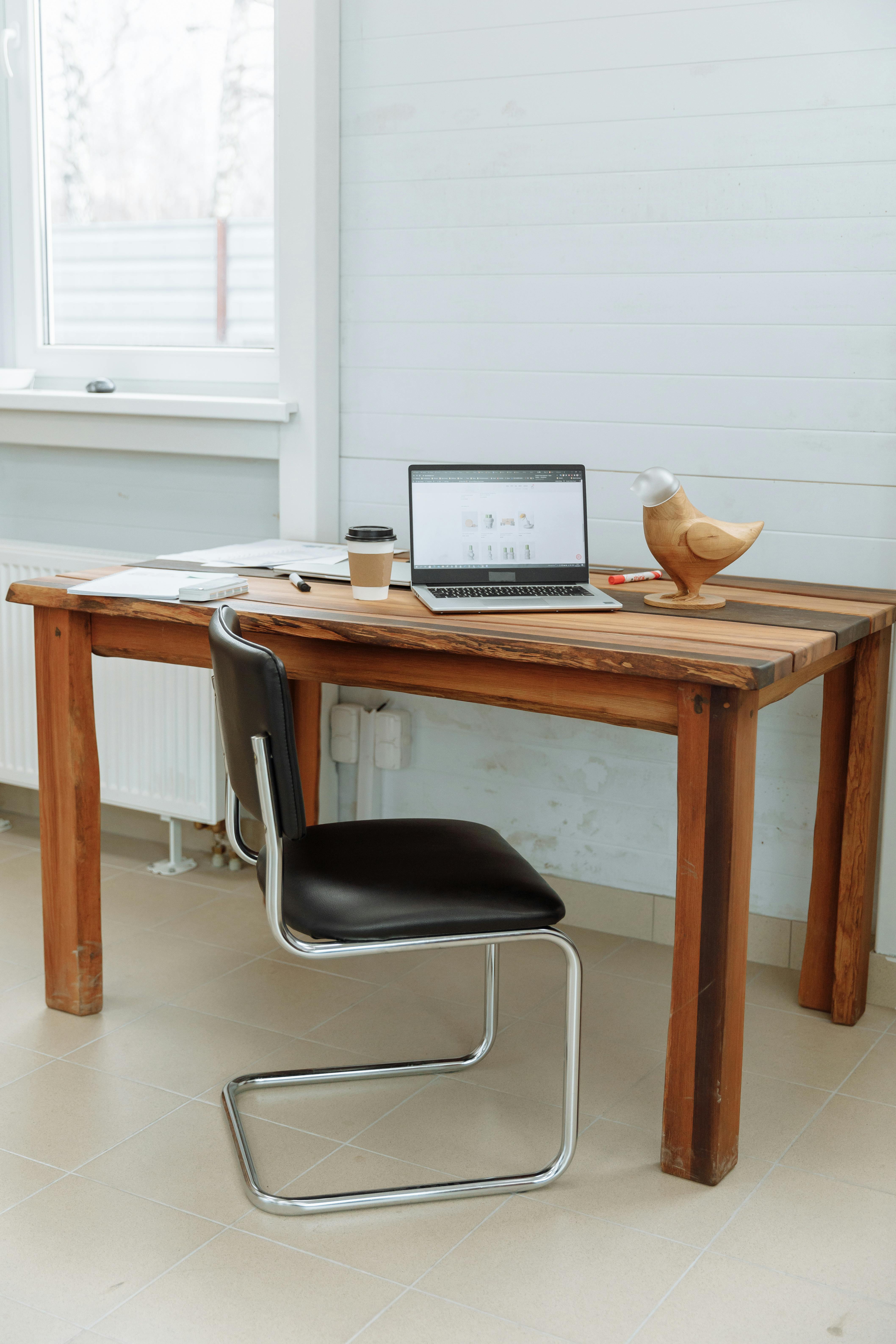 Laptop on a carefully styled desk, representing a polished website setup that may still underperform